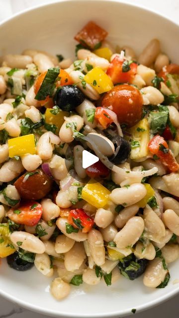 Sandy Coughlin on Instagram: "Loaded with artichoke hearts, olives, sundried tomatoes, and, of course, tender white beans, this Tuscan White Bean Salad is packed with flavor! ❤️ Recipe link in BIO https://reluctantentertainer.com/tuscan-white-bean-salad/ #tuscansalad #whitebeansalad #reluctantentertainer #sogood😋 #cantgetenough" Tuscan White Bean Salad, Tuscan Salad, Tuscan White Bean, White Bean Salad, Sundried Tomatoes, Artichoke Hearts, White Bean, Bean Salad, White Beans