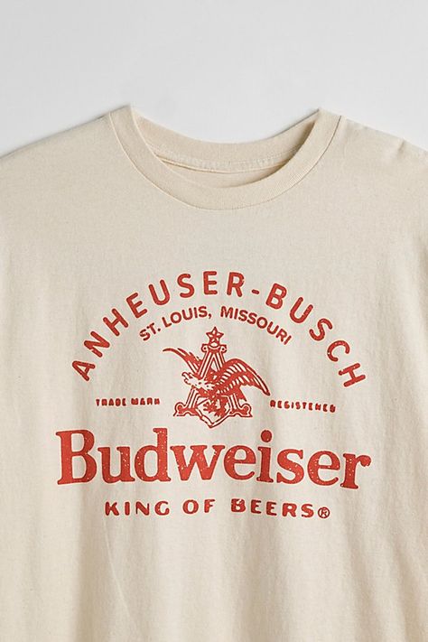 Tee with Budweiser graphics printed at the front. Cotton jersey t-shirt in a standard fit with short sleeves & a ribbed knit crew neck. Features Budweiser graphic tee Regular fit Short sleeves Crew neckline Content + Care 100% Cotton Machine wash Imported Size + Fit Measurements taken from size Medium Chest: 21" Length: 28" | Budweiser King Of Beers Tee in Ivory, Men's at Urban Outfitters Bar Shirt, College Shirts, Fits With Shorts, Graphic Tees Vintage, Graphic Tee Design, Tee Shirt Designs, Beer Shirts, Trendy Shirts, Retro Tshirt