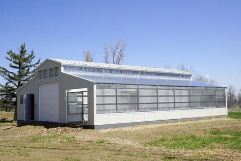 48x48 barn and greenhouse structure with a corridor in the middle that can fit a horse trailer for loading and unloading. Barn With Greenhouse Attached, Barn Greenhouse Combo, Barndominium With Greenhouse, Passive Greenhouse, Greenhouse Structure, Passive Solar Greenhouse, Simple Greenhouse, Tractor Barn, Aquaponics Greenhouse