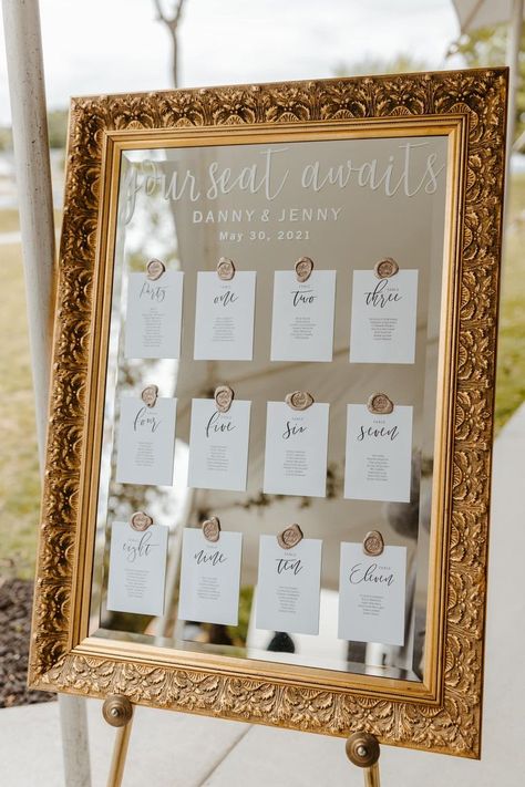 We love this boho/vintage seating chart displayed on a vintage mirror with wax seals holding the place cards. Wax adhesives linked here: https://rstyle.me/+MJPefpnIE2XrOCO35NmOZw https://thevictorianyoungsville.com/blog/f/jenny-dannys-vintage-wedding Wedding Signs For Seating, Table Placement Cards, Cute Place Cards Wedding, Mirror Ideas Wedding, Table Numbers Display Wedding, Seating Chart On Mirror Wedding, Table Numbers On Mirror, Wedding Table Banquet Style, Table Seating On Mirror