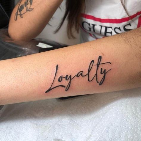 Loyalty Arm Tattoo 1 Humble Tattoos For Women, Loyalty Tattoo For Women Ideas, Over Love Tattoo, Loyalty Over Love Tattoo, Loyalty Tattoo Designs, Tattoos And What They Mean, Loyalty Over Love, Husband Name Tattoos, Love Tattoo Designs