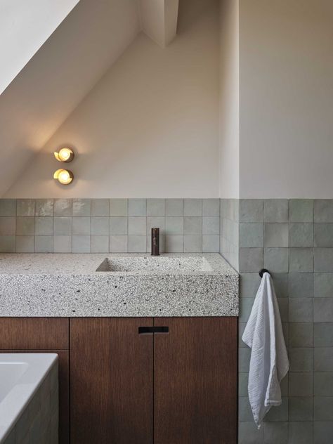 A Seamless Terrazzo Flows From The Wall To The Countertop In This Kitchen Bathroom Terrazzo, Terrazzo Countertop, Terrazzo Sink, Terrazzo Wall, Modern Renovation, Wooden Staircases, Green Cabinets, Green Colour Palette, Wooden Bed Frames