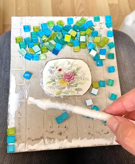 I wanted to make something unique and sparkly using up some pretty pieces of old broken crockery and little bits of mirror tiles. I also wanted to try out a new cement backer board as a way of doing a robust piece that will be ok for garden display. I cut with wheeled tile nippers an old broken plate which has a nice floral centre pattern. Make sure to wear safety goggles. I nibble the china edges slowly around to make a shape that will fit my design. Then time to glue into centr… Pottery Coasters, Garden Display, Broken Mirror, Pen Pal Letters, Backer Board, Safety Goggles, Diy Coasters, Mosaic Garden, Mirror Tiles