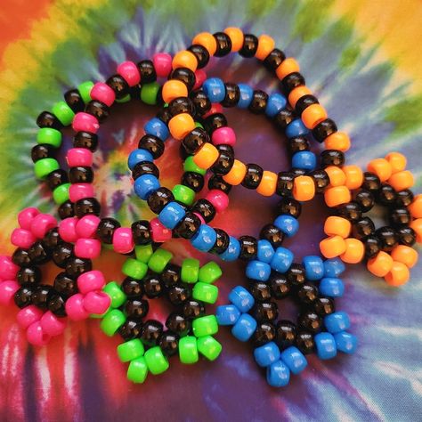 Bundle Of 4 Kandi Star Bracelets As Shown -Handmade By Me New No Tags -Made With Plastic Pony Beads And String -Kandi Stars Measure 1.83 In X 1.83 Inches -Bracelets Are 30 Beads Around There Are Also Matching Earrings Available In My Closet For Sale. Tags: Edc, Edm, Rave, Music Festival, Kandi, Plur, Kawaii, Music Festival, Electric Daisy, Coachella, Pride, Kandi Star Bracelets, Halloween, Cosplay, Y2k, Rave Gear, Retro, Kandi Trading, Kandi Bracelets, Punk, Neon, Vibrant, Gift, Dance, Techno, R Kandi Bracelets Rave, Pride Kandi, Festival Kandi, Kandi Star, Kawaii Music, Scene Bracelets, Bracelets Halloween, Scene Kandi, Star Bracelets