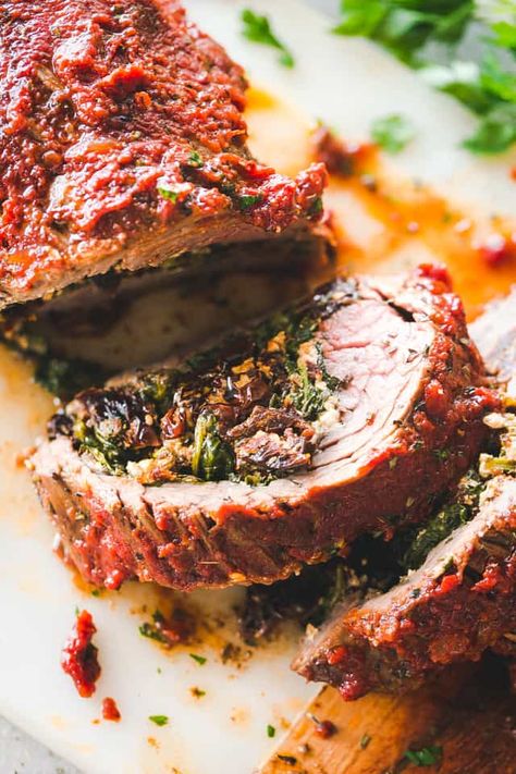 Stuffed Flank Steak Recipe - Tender, juicy, roasted flank steak stuffed with a delicious baby spinach, sun dried tomatoes, and feta cheese filling. Stuffed Skirt Steak Recipes Oven, Stuff Flank Steak Recipes, Stuffed Flank Steak Recipes, Roasted Flank Steak, Holiday Meat Dishes, Hollywood Homecoming, Flank Steak Stuffed, Easy Steak Dinner Recipes, Easy Steak Dinner