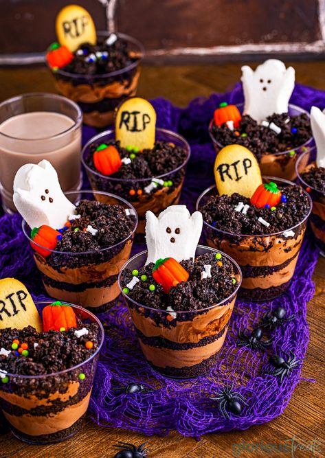 Halloween Graveyard Dirt Cups are just the cutest spooky treat for Halloween! A festive take on the traditional pudding dirt cup dessert, this version utilizes fun halloween candies and cookies decorated to look like tombstones! This adorable dessert is devilishly easy to make and will stand out on any treat table during the spooky season. // Glorious Treats Halloween Pudding Cups, Dirt Cakes, Dirt Cups Dessert, Halloween Pudding, Dirt Cups Recipe, Halloween Popcorn Balls, Dirt Pudding Cups, Pudding Cup Recipes, Chocolate Pudding Cups