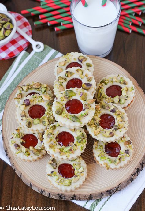 A play on a classic linzer cookie, these Pistachio Wreath Cookies are the perfect treat to make for your Christmas cookie plate! | ChezCateyLou.com Pistachio Christmas, Peanut Butter Reindeer Cookies, Chocolate Dipped Cherries, Linzer Cookie, Xmas Cookie, Christmas Bakery, Chocolate Shortbread Cookies, Wreath Cookies, Cookie Plate