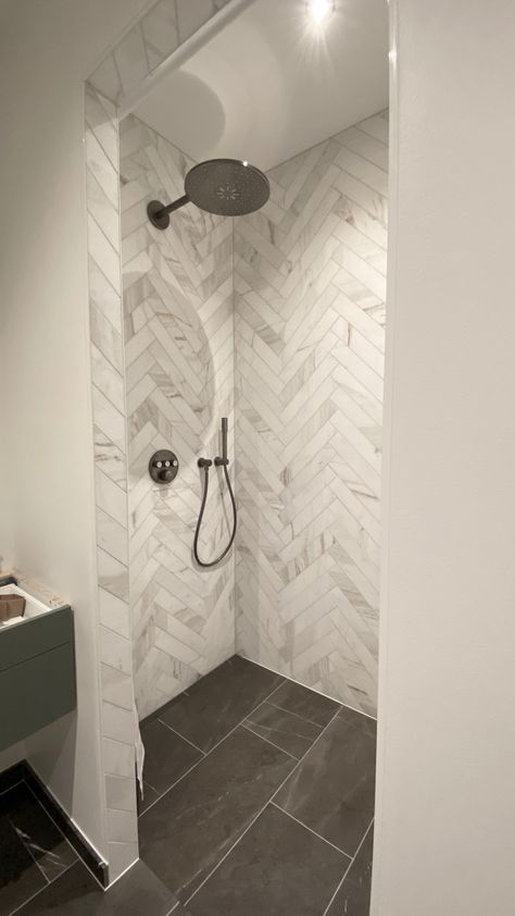 Marble glorious white herringbone Large Marble Herringbone Floor, Shower Remodel Herringbone, Master Bath Tile Shower Ideas Herringbone, Herringbone Tile Shower Wall, Herringbone Bathroom Wall, Bathroom Herringbone Tile, Octagon Tile Bathroom, Herringbone Shower Wall, Taupe Bathroom Tile