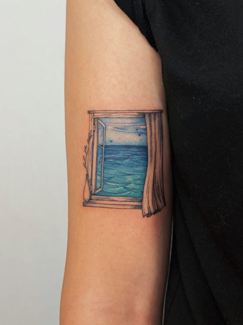 We all miss the sea / ocean sometimes. That’s why this tattoo will let you keep the ocean close at all times. #colortattoo #seaview #oceantattoo Color Tattoo House In The Cerulean Sea Tattoo, Ocean Leg Tattoo, View Tattoo, Ocean Window, San Francisco Tattoo, Sea Tattoo, Waves Sea, Ocean Tattoos, Female Tattoo Artists