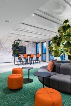 Breakout Office Design, Modern Office Collaboration Space, Office Collaborative Space, Vibrant Office Interiors, Breakout Room Office, Modern Furniture Colors, Relax Room Office, Common Room Design, Office Social Space