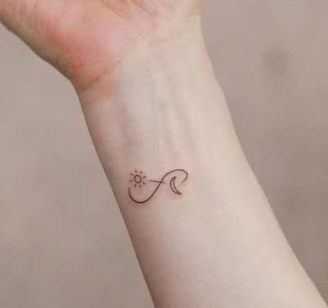 160+ Infinity Tattoo With Names, Dates, Symbols And More (For Women) Small Tattoos Infinity Sign, Sun Moon And Stars Infinity Tattoo, Sun Moon Infinity Tattoo, Mini Infinity Tattoo, Infinity Small Tattoo, Symbolic Love Tattoos, White Infinity Tattoo, Infinity Sun Tattoo, Sun And Moon Infinity Tattoo