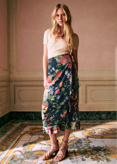 Introducing our Melaine Skirt, a midi-length wrap skirt adorned with the vibrant floral Trianon print. Featuring delicate ruffles on the front and bottom, along with a charming bow on the side, the Melaine exudes Parisian charm. Effortlessly transition from daytime chic to evening elegance by pairing the Melaine Skirt with a crisp white blouse and sandals for a casual look, or dress it up with heels and statement jewelry for a night out. Explore more on sezane.com Crisp White Blouse, Midi Wrap Skirt, Midi Skirt Outfit, Skirt Floral, White Blouse, Parisian Style, Wrap Skirt, Skirt Outfits, Statement Jewelry