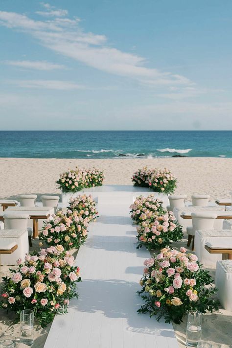 Find all the best ideas for beach wedding decorations, plus tips to bring your dream beach wedding ideas to life for your sandy big day. Simple Elegant Beach Wedding, Spring Beach Wedding, Budget Beach Wedding, Beach Wedding Pics, Elegant Beach Wedding, Beach Wedding Aisles, Beach Wedding Ideas, Simple Beach Wedding, Beachside Wedding