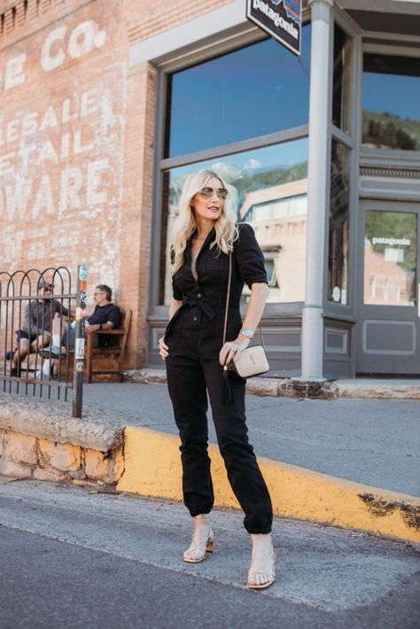 Over 40 blogger wearing a denim jumpsuit Black Denim Jumpsuit Outfit, Denim Jumpsuit Outfit Black Women, Utility Jumpsuit Outfit, Annie Bing, Denim Jumpsuit Outfit, How To Wear A Jumpsuit, Black Denim Jumpsuit, Utility Jumpsuit, Simple Black Dress