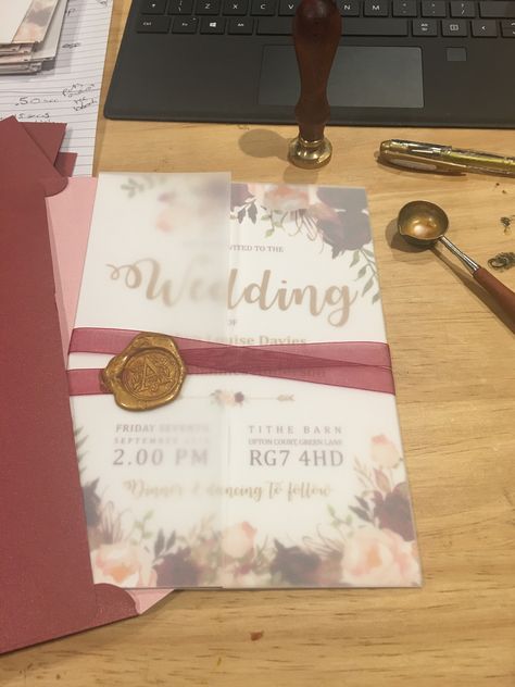 Burgundy and gold wedding invites, floral design, in tracing paper sleeve with ribbon and wax seal Tracing Paper Invitation, Ribbon And Wax Seal, Gold Wedding Invites, Burgundy And Gold Wedding, Muslim Wedding Invitations, Paper Invitation, Transparent Paper, Tracing Paper, Gold Wedding Invitations