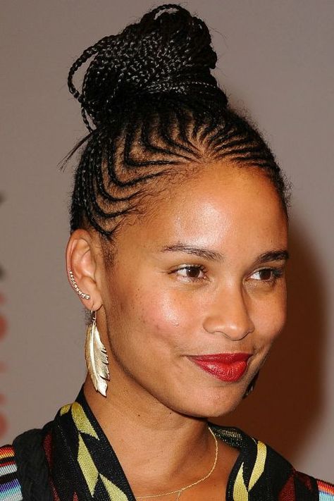 Natural Hairstyles -  Joy Bryant - "Cornrows are a timeless, universal style," says Sims. "It's cool to incorporate different braid lines and angles as opposed to the traditional row." Pull them into a high bun like Joy does here to get extra mileage out of the look. Cornrow Hairstyles Updo High Bun, High Bun Cornrows Braided Updo, Cornrow High Bun, Braids Lines Hairstyles African, Braids Editorial, Braids Lines Hairstyles, Buns For Long Hair, Cornrow Updo, Cornrows Updo