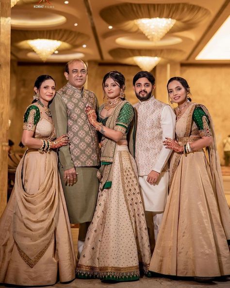 This family's color-coordinated outfit game is on point. 👌Agree? If you too planning for color-coordinated dress theme for wedding festivities then save this post for inspiration. 😍 Outfit: @jiviva_ HMUA: @sejal_savaliya22 & team Photography: @koratfilms #indianwedding #wishnwed #lehenga #lehengacholi #lehengalove #lehengas #lehengablousedesigns #lehengasaree #lehengainspiration #lehengagoals #lehengacollection #ehengadesigns #lehengastyle #lehengacholionline #designerlehenga Indian Bridal Family Outfits, Indian Family Wedding Outfits, Family Same Dress Indian Wedding, Family Outfits For Wedding Indian, Family Traditional Outfits Indian, Matching Family Outfits For Wedding, Family Photo Outfits Indian, Family Matching Outfits Indian Wedding, Indian Wedding Family Photos