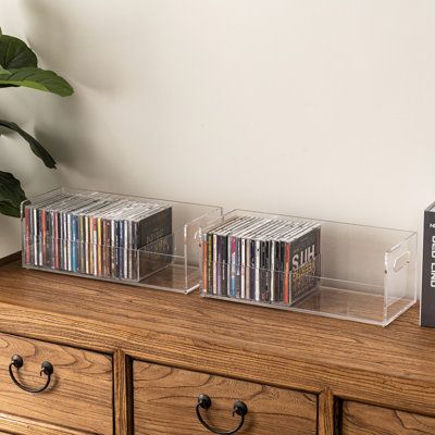 Effortlessly organize and showcase your music collection with this versatile set of 2 modern stackable acrylic CD holder racks. Crafted from premium clear acrylic, these CD organizer crates offer a sleek and space-saving solution for storing your CDs. Stack them vertically for efficient storage or place them individually on various surfaces like tables, desktops, or bookshelves. Each rack holds up to 35 standard-size CD jewel cases, totaling up to 70 CDs, and features an open-top design for easy Creative Cd Storage, Cd Display Ideas, Cd Collection Aesthetic, Cd Storage Ideas, Music Organization, Cd Organizer, Album Cover Wall Decor, Cd Organization, Cd Display