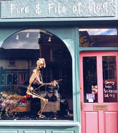 Halloween shop window display. Golden skeleton riding a broom wearing jewellery from Fire & File Metal Design Halloween Shop Window Display Ideas, Window Display Halloween, Halloween Window Display Retail, Halloween Store Window Display, Halloween Shop Window Display, Halloween Store Windows, Halloween Shop Window, Vitrine Halloween, Creative Window Display