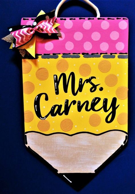 Thank you for looking at our Teacher and Nurse signs.  They are perfect for any classroom, nurse's office, as personalized name/room signs.    Great for indoor or outdoor display! Perfect for your favorite TEACHER! ALL OUR SIGNS ARE TREATED FOR INDOOR-OUTDOOR DISPLAY! Painted PENCIL plus Decorative Painted Accenting & Black Vinyl Lettering plus a Decorative Bow...Has an attached White Rope Loop for easy hanging. . To view all our teacher signs, click the link below: https://www.etsy.com/shop/3Cr Teacher Pencil Sign, Pencil Sign, Teacher Wall, Classroom Door Signs, Teacher Door Hangers, Teacher Doors, Wooden Door Hanger, Hanger Decor, Teacher Signs