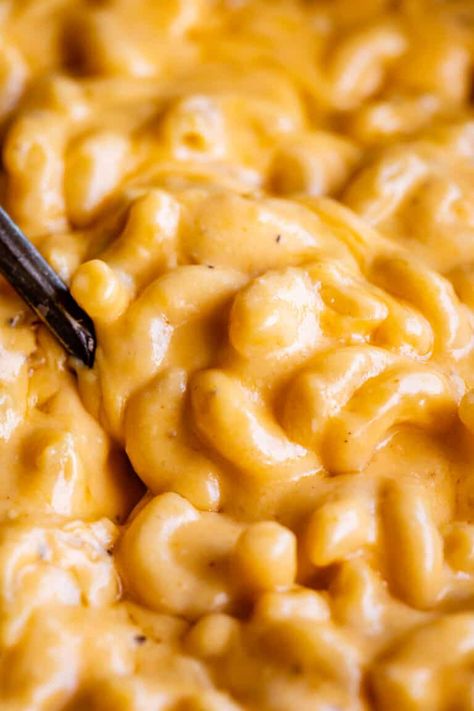 To-Die-For Slow Cooker Mac and Cheese from The Food Charlatan. Creamy, cheesy, buttery Mac and Cheese HEAVEN, made in the slow cooker. We're not even boiling the noodles first! You literally dump all the ingredients, including the DRY pasta, into your crock pot and leave it. Then suddenly you are putting hot, cheesy, creamy, stuff-of-dreams mac and cheese into your mouth! Perfect make ahead macaroni and cheese for Easter, Christmas, Thanksgiving, summer bbqs. Can be a side dish or main dish! Make Ahead Macaroni And Cheese, Slow Cooker Mac And Cheese, Crockpot Mac N Cheese Recipe, Macaroni Salads, Dry Pasta, Crockpot Mac And Cheese, Cheesy Mac And Cheese, Stovetop Mac And Cheese, The Food Charlatan