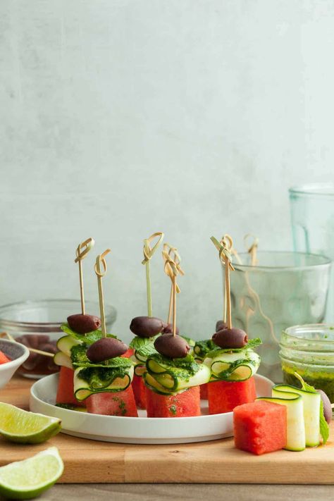 Sweet watermelon and crisp cucumbers make these watermelon skewers with minty lime oil a simple and refreshing summer appetizer. Watermelon Skewers, Watermelon Appetizer, Mint Oil, Sweet Watermelon, Grain Free Granola, Lime Oil, Summer Appetizer, Light Snacks, Watermelon Recipes