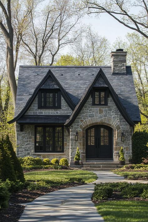 Modern gothic style cottage facade with gabled slate roof farmhouse landscape. Check out all of these modern gothic-style cottages that blend dark elegance and contemporary flair to create stunning exteriors. One Story Cottage Exterior, Gothic Tiny House Plans, Light House Dark Trim Exterior, Cottage Aesthetic Exterior, Styles Of Homes Architecture, Whimsical House Exterior, Small Gothic House, Modern Victorian Homes Exterior, Exterior Black House