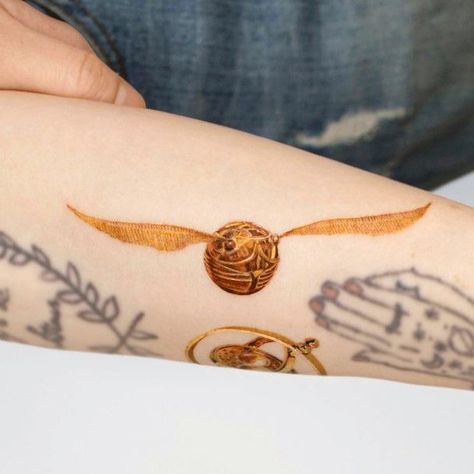 Top 100 Best Golden Snitch Tattoos For Women - Harry Potter Design Ideas Harry Potter Sorting Hat Tattoo, Sorting Hat Tattoo, Golden Snitch Tattoo, Snitch Tattoo, Harry Potter Design, Hogwarts Quidditch, Harry Potter Sorting Hat, Golden Snitch, Sorting Hat