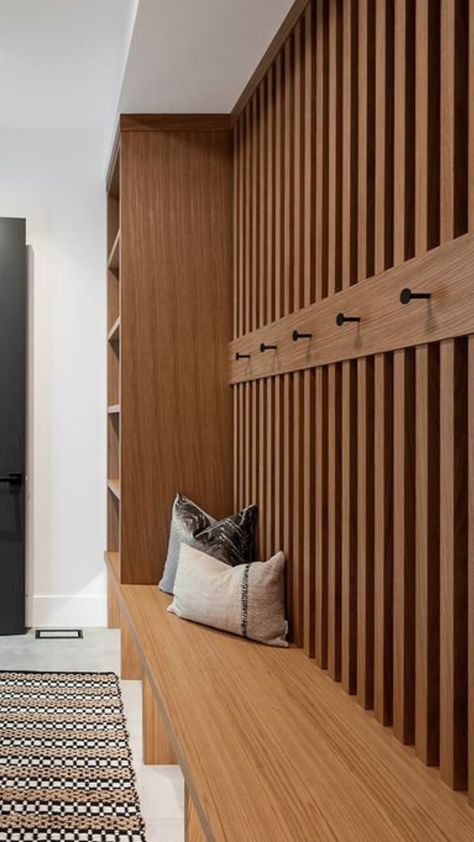 Step into this stunning mudroom from our Anscomb Modern project featuring this beautiful tone of earthy brown custom cabinetry. Streamline your spaces to fit into your daily routine.   #SpringCleaning #Mudrooms #LuxuryMudrooms #LuxuryHomes #HomeDesign #CustomCabinetry #VancouverIslandHomes #MudroomMakeover Wood Panel Mudroom, Mcm Mudroom, Mid Century Mudroom, Mid Century Modern Mudroom, Scandinavian Mudroom, Modern Mudroom Ideas, Mudroom Modern, Modern Mud Room, Entryway Mudroom Ideas