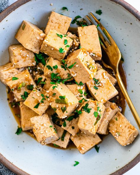 This marinated tofu doesn't even need to be cooked! Flavored with soy, sesame oil and ginger, this easy tofu recipe will be your new favorite. (It's ours.) #tofu #recipe #marinated #plantbased #vegan Marinaded Tofu Recipes, Firm Tofu Marinade, Simple Tofu Marinade, Savory Tofu Marinade, How To Season Tofu, Crispy Soy Garlic Tofu, Press Tofu, Cold Tofu, Tofu Seasoning