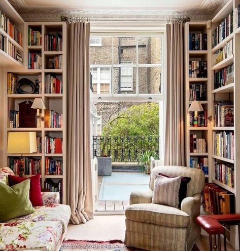 If you want to convert a small spot by the window into a cozy reading corner or mini-home library, floor-to-ceiling bookshelves offer a practical solution. Image credit: INSTAGRAM @BOOKS.PLACES.BOOKSTORES Mies Van Der Rohe Interior, Small Home Library, Cozy Reading Corner, Cozy Home Library, Floor To Ceiling Bookshelves, Round Desk, Cozy Reading Corners, Corner Bookshelves, Mini Home