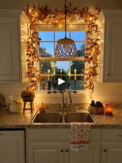 3.4M views · 80K reactions | DIY Cozy fall window!🎃 Comment FALL and I’ll send you links to everything I used! ❤️ The fall garland I used is some of my FAVORITE fall garland! I love the muted orange and brown tones. I also love the size and shape of the leafs! Anyways, when do you start decorating for fall? I will probably start in August!(This video is from last year) I’m getting excited for all things cozy! Pumpkin patches, bonnfires, and trick or treating!!🎃#falldecorations #diyfalldecor #falldecor #falldecoratingideas #fallhomedecor #falldecorating #falldecoration #diyhomedecor #diydecor #diyhalloween #halloweendecoration #halloweendecor #halloweeniscoming #spookyseason👻 | Our Winton home | Oskar Schuster · The Pumpkin's Song (Menu Theme) Fall Window Kitchen, Fall Garland Over Kitchen Window, Fall Garland Around Kitchen Window, Fall Stair Railing Decor, Fall Office Window Decor, Kitchen Sink Window Fall Decor, Fall Decor Bay Window, Fall Above Kitchen Cabinet Decorations, Fall Decor Stairs