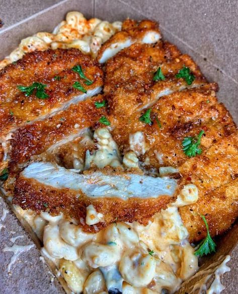 Experience the perfect blend of flavors with this Cajun mac and cheese with crispy Hennessy-glazed fried chicken. The creamy, spicy mac and cheese is made with a blend of cheddar, mozzarella, and Parmesan cheese, and is seasoned with cajun spices for an extra kick. The fried chicken is coated in a mixture of flour, eggs, and breadcrumbs, then fried to crispy perfection. The chicken is then glazed with a mixture of Hennessy cognac, honey, butter, and cajun seasoning for a sweet and savory finish. Hennessy Glazed Fried Chicken, Glazed Fried Chicken, Cajun Mac And Cheese, Spicy Fried Chicken, Gumbo Recipe, Honey Glaze, Think Food, Food Goals, Food Videos Cooking