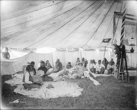 A group of Native American people sitting inside a tent during the gift dance. Indian reservations, Montana. 1902-1933. Richard Throssel Collection, American Heritage Center, University of Wyoming. Dance Indian, Native American Reservation, University Of Wyoming, First Peoples, Native American Peoples, Heritage Center, People Sitting, American People, American Heritage