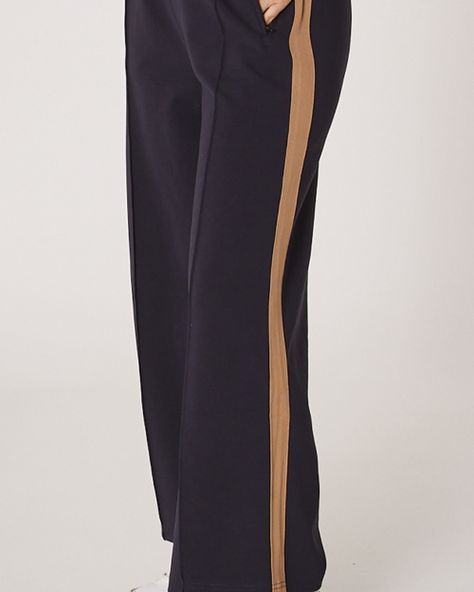 Love an Adidas track fit? Not so much the price tag? Same! Meet the Noah Pants, with their cute side stripe and beautifully luxe fabrication, you won’t want to take them off!! Features include, elasticated waist, wide leg, cropped length, twin side taping stripe detailing, side pockets with zips, pintuck detail on centre front leg (looove), relaxed styling all finished in a beautiful cotton blend. We have a few different colour versions coming however you can shop the Navy/Camel and Black ... Adidas Track, The Navy, Side Stripe, Pin Tucks, Price Tag, Relaxed Style, Camel, Wide Leg, Lounge Wear