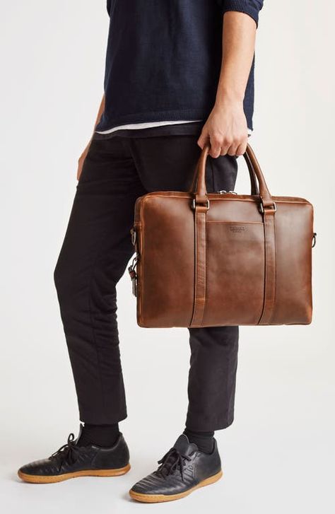 "Find SHINOLA Navigator Leather Computer Briefcase on Editorialist. This spacious briefcase combines rich calfskin leather and a cotton canvas lining with nickel-plated brass hardware for a classic look. Slightly slimmer than the classic Navigator, it provides easy access to your laptop housed within an interior padded foam pocket. Zip closure Top carry handle; optional, adjustable shoulder strap Exterior zip pockets Interior wall and zip pockets; laptop sleeve fits most 15\" laptops Detachable