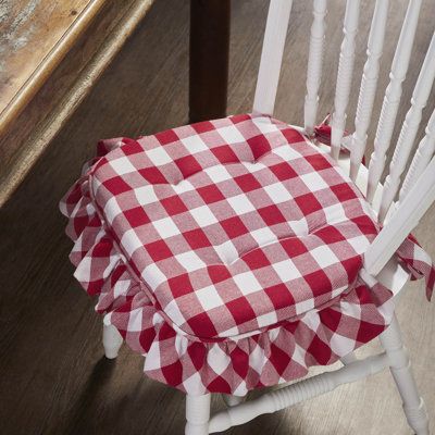 Elevate the comfort and style of your dining or kitchen chairs with the VHC Brands Chair Pad from the Annie Buffalo Check Collection. Measuring 16.5x18 inches, this chair pad embodies farmhouse and country aesthetics with its classic buffalo check pattern. Crafted with a twill weave and textured finish, it adds a touch of rustic charm to your indoor seating. Designed with ties, this chair pad securely fastens to your chairs, ensuring a snug and stylish fit. Its plaid design is both versatile and Buffalo Check Shower Curtain, Outdoor Chair Pads, Ribbon Display, Folding Towels, Room Maker, Diy Kitchen Table, Primitive Santa, Wooden Barn, Vhc Brands