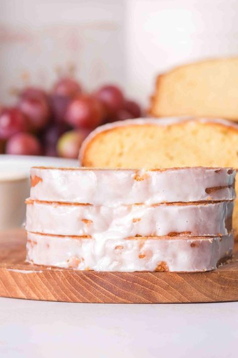 Pound cake is a timeless favorite, and this sour cream version is truly irresistible! With a hint of vanilla and the added appeal of sour cream, it stays so moist and offers a yummy tang. You’ll find this recipe super-simple to whip up. The loaf comes out soft and delicious, and to top it all off, there’s a sweet glaze that you can customize with your favorite flavors or colors if you like. Enjoying a slice of this scrumptious cake alongside your favorite coffee or tea is always such a treat. Vanilla Sour Cream Cake, Vanilla Pound Cake Loaf, Dessert Recipes With Sour Cream, Bread With Sour Cream, Cake Recipe With Sour Cream, Sour Cream Cake Recipe, Vanilla Loaf Cake, Sour Cream Desserts, Crumb Cakes