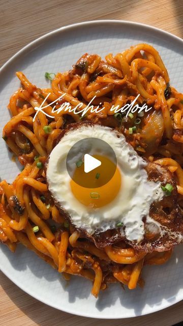 Verna | London food & homecook on Instagram: "KIMCHI UDON // it’s been a hot minute since I made this and MY GOD I forgot how much I love it 😭 that first bite of the slurpy saucy kimchi udon with the creamy yolk from the fried egg was INCREDIBLE 🔥 ofc you can skip the egg too if you’re vegan! It’s super customisable.

You can find the full recipe, as well as a ton of other delicious things to make in my cookbook, HAVE YOU EATEN?. Link is in my bio! ⬆️ 

—
Ingredients:
- 1 tbsp gochujang
- 80g sliced kimchi, roughly chopped
- 1 shallot or half a red onion
- 1 pack fresh udon noodles, soaked in hot water
- 1 tbsp honey or agave
- 1 tbsp light soy sauce
- 1 ladle of noodle water

Serve with a crispy fried egg and garnish with spring onions. Enjoy!

#easyrecipes #comfortfood #kimchi #noodles Kimchi Udon, Pork Udon, Kimchi Noodles, London Eats, Udon Noodles, Spring Onions, London Food, Things To Make, Spring Onion