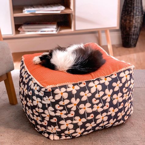 Make this comfy pouffe for your living room to use as a foot rest when you want to relax or even as an extra seat if you have guests. (or if like me, your cat claims it for their own, it can be a very luxurious cat bed...) Here's how you can make your own! #sewingtutorial #howtosew #homedecordiy #sewing Pouffe Sewing Pattern, Sew A Cat Bed, Sewing For Cats Diy Projects, Sewing Cat Bed, Cat Bed Diy Sewing, Pouffe Pattern, Pet Bed Pattern, Cat Bed Pattern, Diy Cat Bed