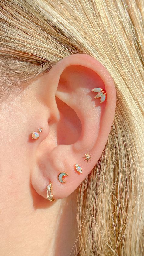 Shop our 14k solid gold piercing collection. Featuring genuine diamonds and real Australian opal. Adorn your ears with our fine jewellery. Opal Helix Piercing, Opal Piercing Jewelry, Opal Ear Stack, Ear Piercings Aesthetic Gold, Opal Ear Curation, Opal Earring Stack, Opal Ear Piercings, Gold Ear Stack, Piercings Chart