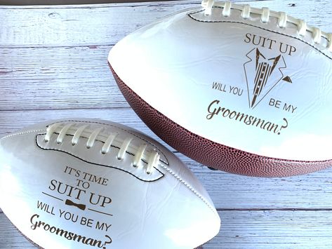 "FOR UNITED STATES FREE SHIPPING ORDERS OVER $35 AND 25% OFF STORE WIDE YEAR END SALE These Groomsman, Best Man, or Ring Bearer proposal footballs are a great way to ask the guys to be on your team for that special day! The engraving comes out to a warm brown color with easy to read contrast. This is an \"engraved\" football and when engraved into the leather it is permanent and reveals the natural brown color. There is NO other color option available. The engraving will last forever and will no Junior Best Man Proposal, Ring Bearer Proposal Football, Groomsmen Proposal Football, Junior Groomsmen Proposal, Groomsman Proposal Ideas, Ring Bearer Security, Velvet Invitation, Ring Bearer Proposal, Best Man Proposal