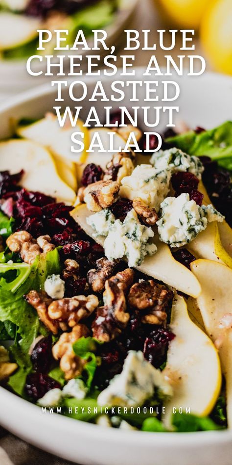 Pear, Blue Cheese and Toasted Walnut Salad combines the flavors of juicy pears with sharp blue cheese, toasted walnuts and a tangy walnut oil vinaigrette. This intense flavor combination atop a bed of mixed greens and sprinkled with dried cranberries will be your new go-to salad. It's a perfect meal in itself but also great alongside your main course for dinner. This salad always impresses a crowd and you'll be glad you made it! Carmelized Pear And Blue Cheese Salad, Baked Pears With Cranberries, Roasted Pears With Blue Cheese, Poach Pear Salad, Canned Pear Salad Recipes, Blue Cheese Pear Salad, Warm Pear Salad, Salad Appetizer Recipes, Baked Pears With Blue Cheese