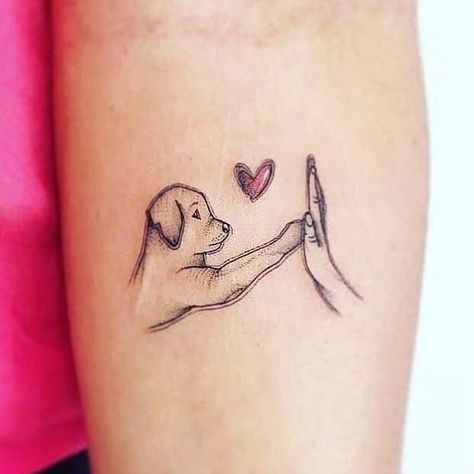 Adorable Puppy Love Hand Tattoos for Girls: Cute and Simple Designs! Strength Tattoo Designs, Feminine Thigh Tattoos, Tattoo Ideas Female Small, Simple Hand Tattoos, Puppy Tattoo, Small Dog Tattoos, Tato Dengan Makna, Simple Tattoos For Women, Black Tattoo Cover Up