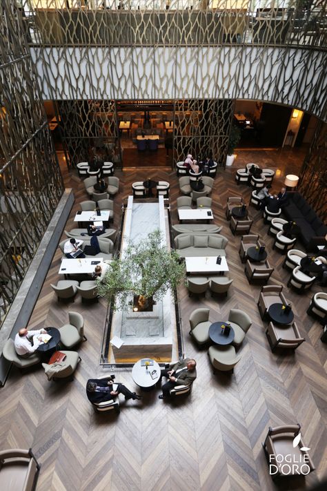 Geometric wood flooring at this grand hall and bar/restaurant at this turkish Hotel, in Ankara, are designed and enriched with @fogliedoro 45°chevron floor. Solid walnut in Ca' Corner finish, smoked, brushed, stained, varnished. Discover the full project here - https://fogliedoroparquet.com/en/projects/commercial/passage-to-east-12/ #fogliedoro #woodfloors #woodflooring #customproject #designproject #hospitalityproject #solidwalnut #solidwood #chevronflooring #chevronpattern #chevrontexture Lobby Plan, Restaurant Floor Plan, Cafeteria Design, Bar Flooring, Restaurant Flooring, Modern Cafe, Grand Hall, Hotel Reception, Restaurant Lounge