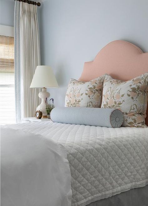 Restful cottage bedroom features a blush pink linen headboard supporting a bed accented with blue and pink floral pillows placed behind a blue stripe bolster pillow. Ruched Bedding, Katie Davis Design, Blue And Pink Bedroom, Katie Davis, Wood Canopy Bed, Pink Headboard, Linen Headboard, Pink Room Decor, How To Dress A Bed