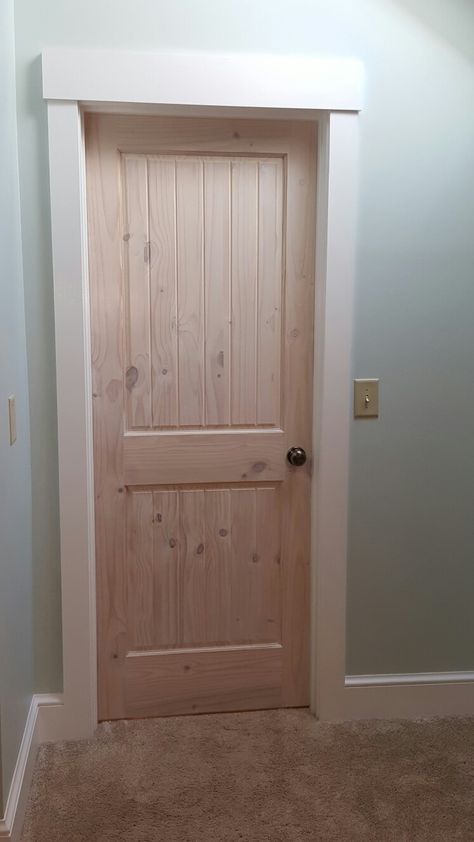 Knotty Pine Door.  White Washed with Craftsman Style white trim. www.seaybuildersinc.com White Wash Wood Interior Doors, Trim And Baseboard Ideas, Interior Farmhouse Doors, Farmhouse Trim Baseboards, Farmhouse Style Trim, Farmhouse Window Trim, Knotty Pine Doors, Ranch Cottage, Farmhouse Interior Doors