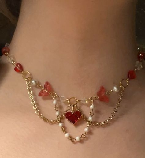 Swiftie Red choker (adjustable) $35.00 Now available 💋 #red #redtaylorsversion #redtv #heart #heartshaped #taylorswift #swiftie #erastour #gemstones #gemstonejewelry #literature #dragons #dragon #greekmythology #beadsjewelry #cottagecore #fairycore #smallbusiness #smallbusinessowner #smallbusinesssupport #flowers #flower #flowerjewellery Coquette Jewelry, Homemade Necklaces, Red Choker, Pretty Jewelry Necklaces, Diy Jewlery, Fairy Jewelry, Beaded Necklace Diy, Diy Bracelet Designs, Easy Diy Jewelry