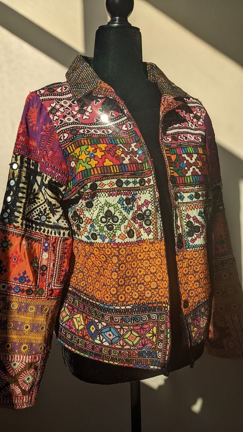 [Sponsored] This Patchwork Jacket Is Made Of Hand Embroidered Panels Stitched Together To Form A Boho Style Blazer. These Embroidered Patches Were Sourced From Tharparkar Region Of Sindh And Some Parts Of Balochistan. Each Section Of Embroidery Consists Of Different Styles Of Threadwork And Mirror Work Native To The Region, With Some Overlapping Techniques Of Baloch Styles. Some Of The Styles Of Embroidery Included Are But Not Limited To: Kaacha Taanka, #patchworkjacketsforwomen Gujrati Jackets For Women, Embroidery Jacket Design, Patch Work Lehenga, Patch Work Embroidery, Patch Work Jacket, Patchwork Jackets For Women, Embellished Jackets, Garba Outfit, Jacket Patchwork