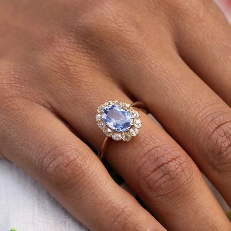 Antique Jewelry Victorian Rings, Blue Diamond Gold Ring, Saphire Engament Ring Set Light Blue, Indy Blue Wedding Ring, Oval Diamond With Sapphire Side Stones, Light Blue Stone Engagement Ring, Gold And Blue Ring, Engagement Rings Old Fashioned, Cornflower Blue Engagement Ring